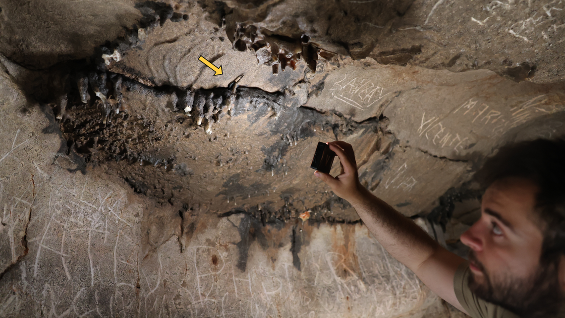 Scientists identified a 1,900-year-old Roman sanctuary at Cova de les Dones after finding inscriptions and a coin offering.