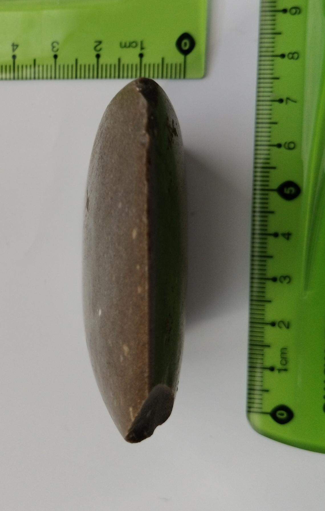 The 4,500-year-old ax as seen looking down the sharpened blade edge.