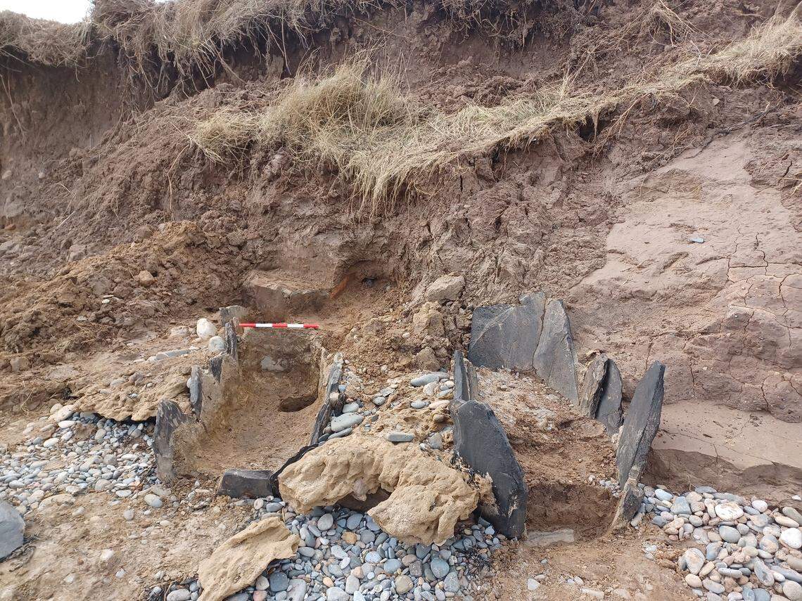 A close-up photo shows the centuries-old bait tanks found on a beach in Foxton.
