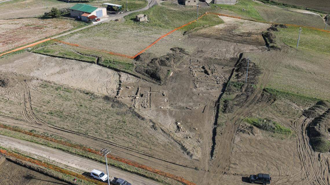Archaeologists found a 1,700-year-old Roman settlement with hundreds of graves during railway construction in Sicily, Italy, photos show.