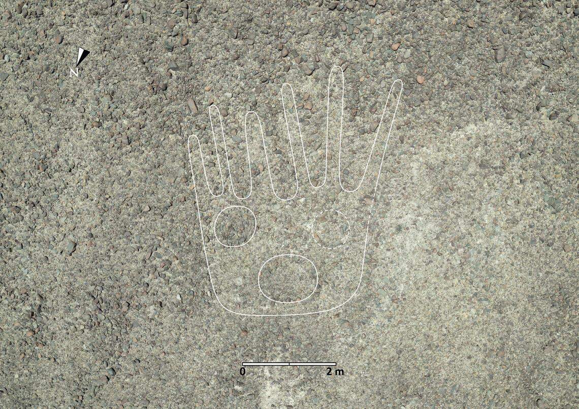 A 2,000-year-old Nazca geoglyph showing a decapitated head. The figure was outlined in white by researchers.