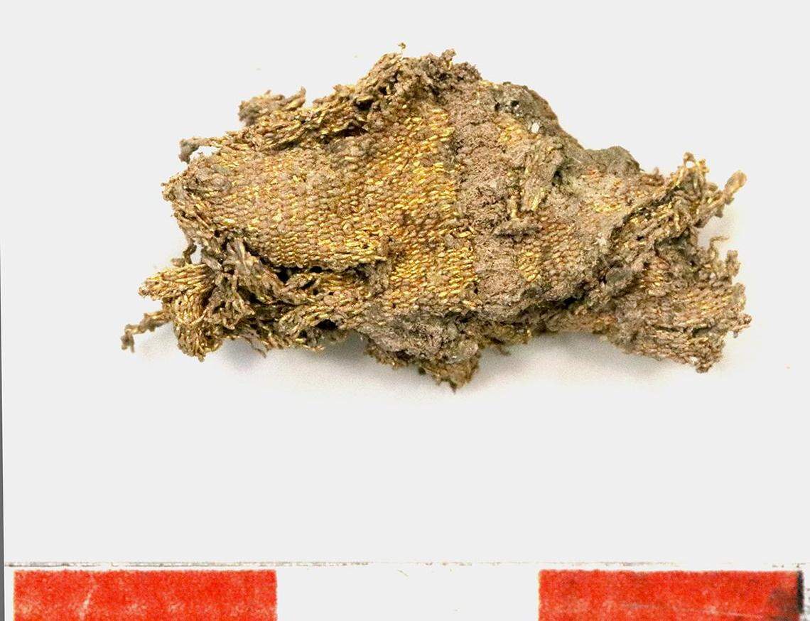 A fragment of the gold fabric from Burial 47 after being cleaned.