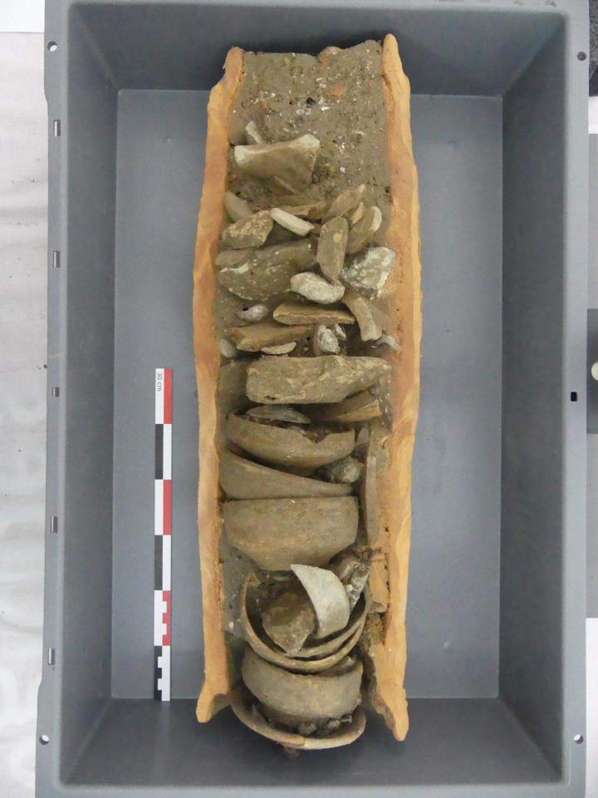 An ancient Roman libation conduit, still filled with gifts, found in Narbonne.