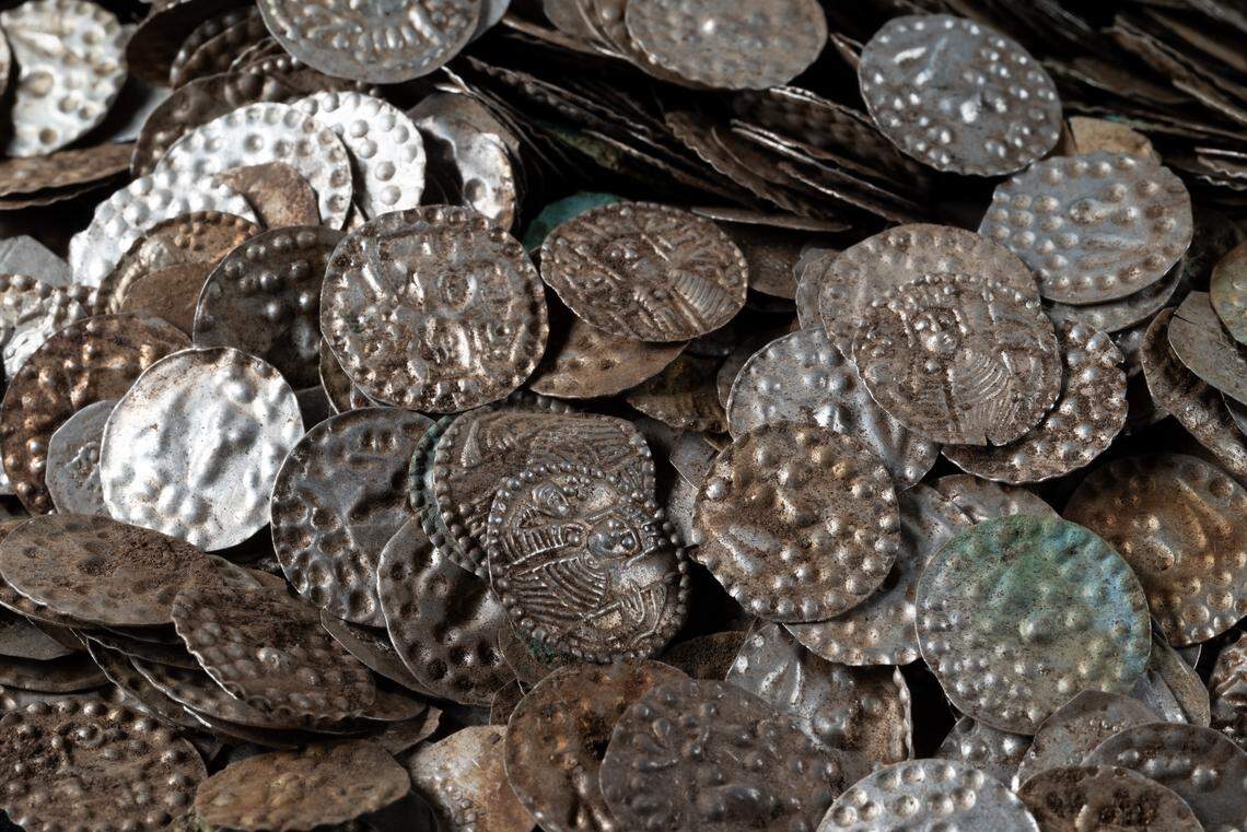 Some of the 800-year-old silver coins found by a homeowner in Stockholm County.