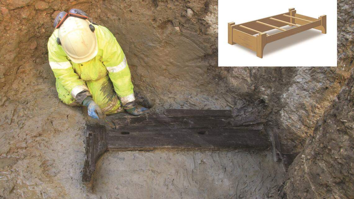 An archaeologists excavates the ancient Roman bed. A smaller diagram shows what the bed might have looked like.