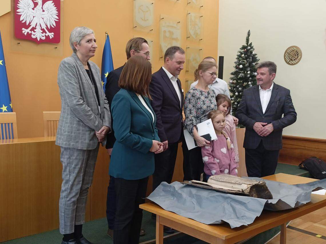 The family who found the 16th century Bibles with Polish officials during a news conference about the find.