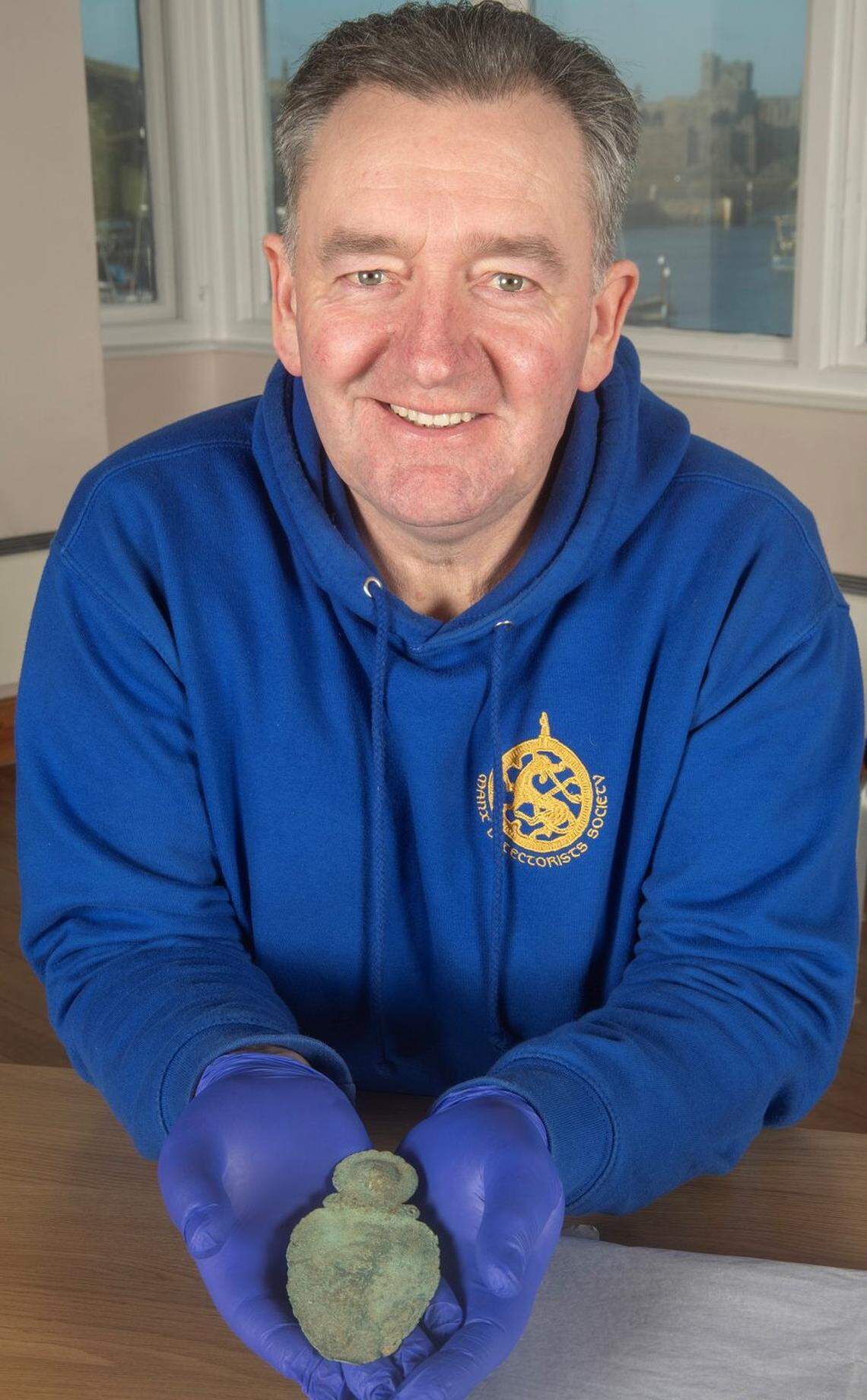 Rob Middleton holds the “rare” ancient spoon he found in Patrick.