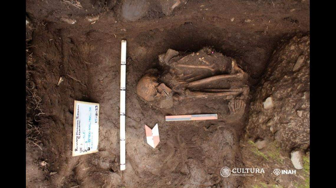 The woman’s extremities were flexed, indicating that she was wrapped before she was buried, archaeologists said.