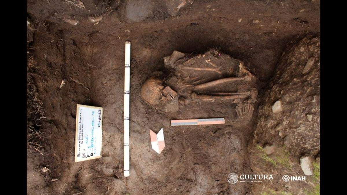 The woman’s extremities were flexed, indicating that she was wrapped before she was buried, archaeologists said.