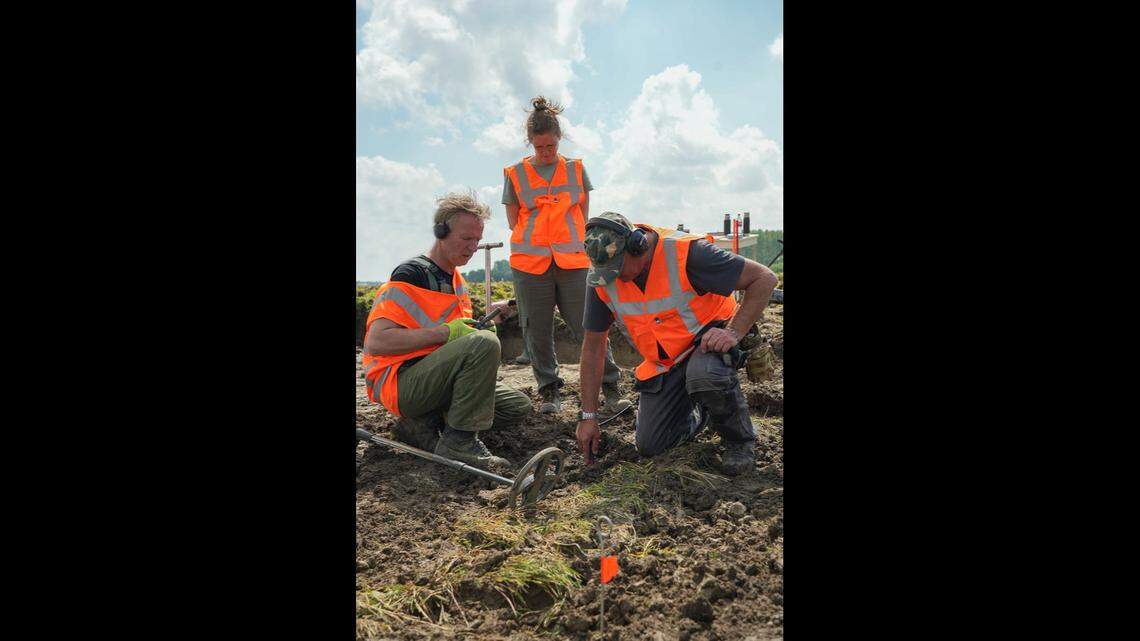 Metal detectorists and archaeologists unearthed over 400 of ancient British, Roman and African coins linked to a military conquest, photos show.