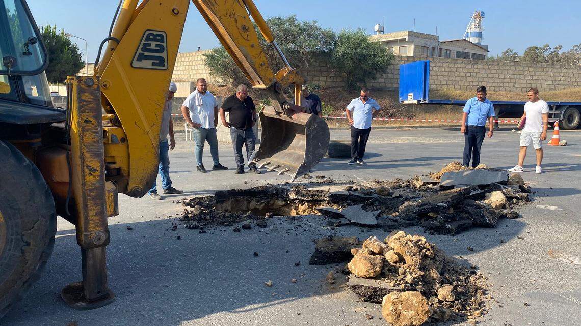 Part of a road in Cyprus collapsed, revealing a long-forgotten tomb from about 2,000 years ago, officials said. Photos show its artifacts.