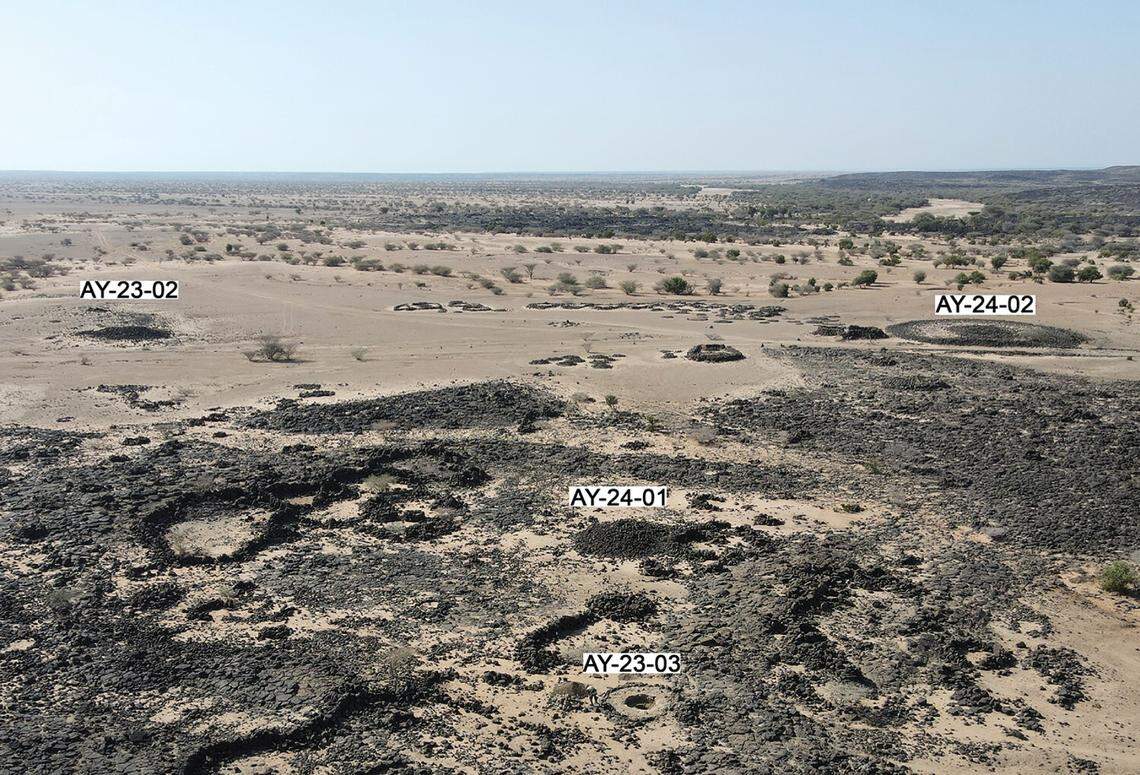 An aerial view of a cairn cemetery in southern Djibouti with four cairns labeled.