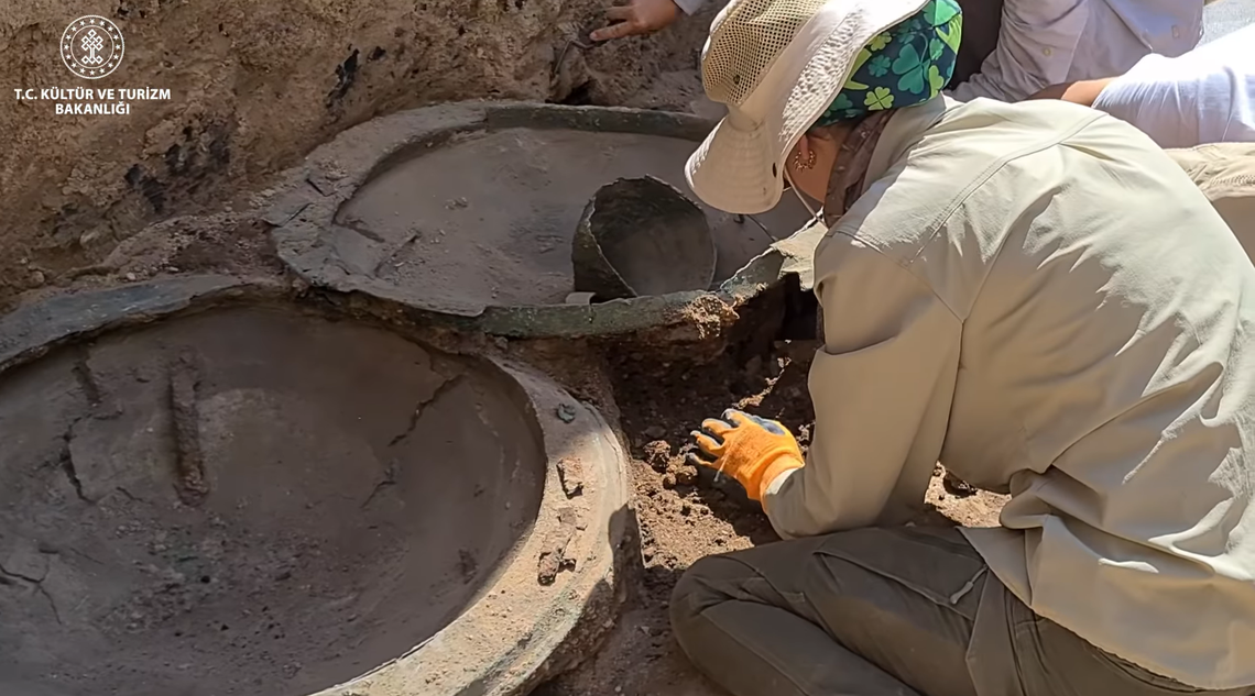 The 2,600-year-old shields and helmet found at the Ayanis temple.