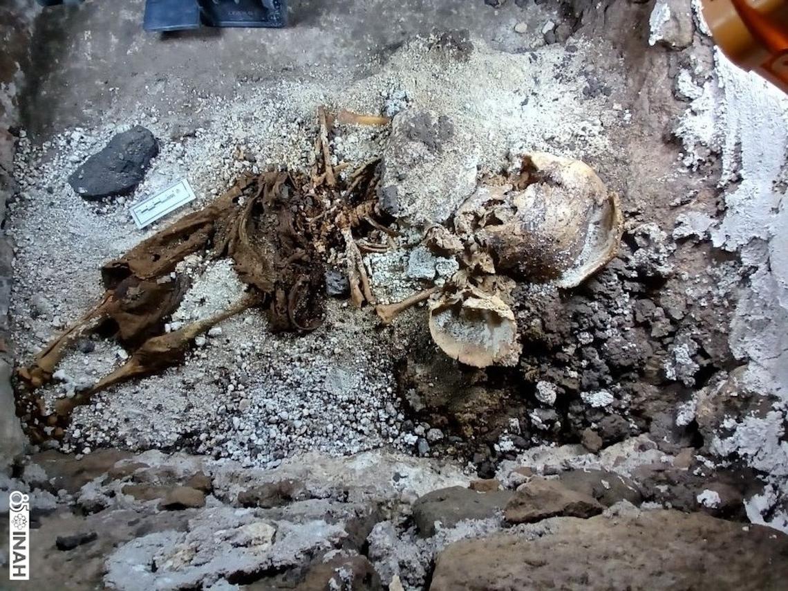 The century-old grave of a child found in the church crypt and labeled M1.