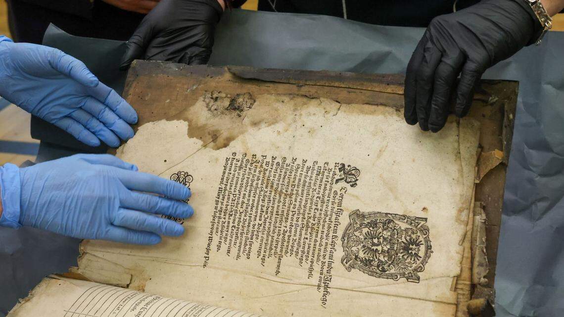 A family renovating the roof of their house stumbled on two hidden manuscripts identified as 16th-century Brest Bibles, photos show.