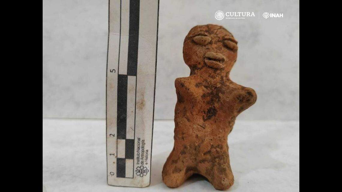 A figurine was found at the burial site, experts said.