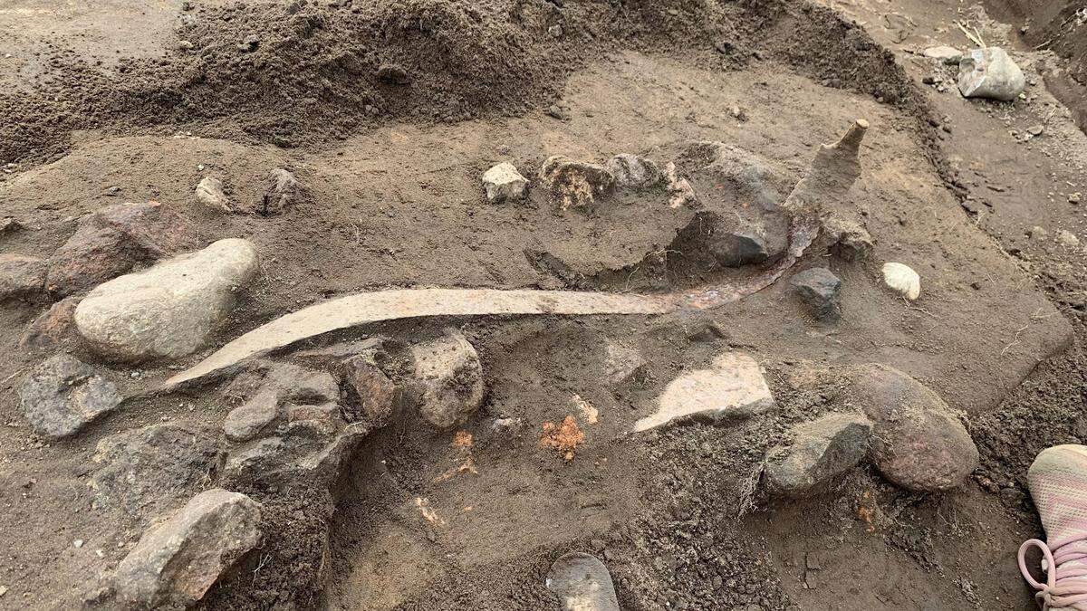 Some of the half-buried weapons found in Løsning.