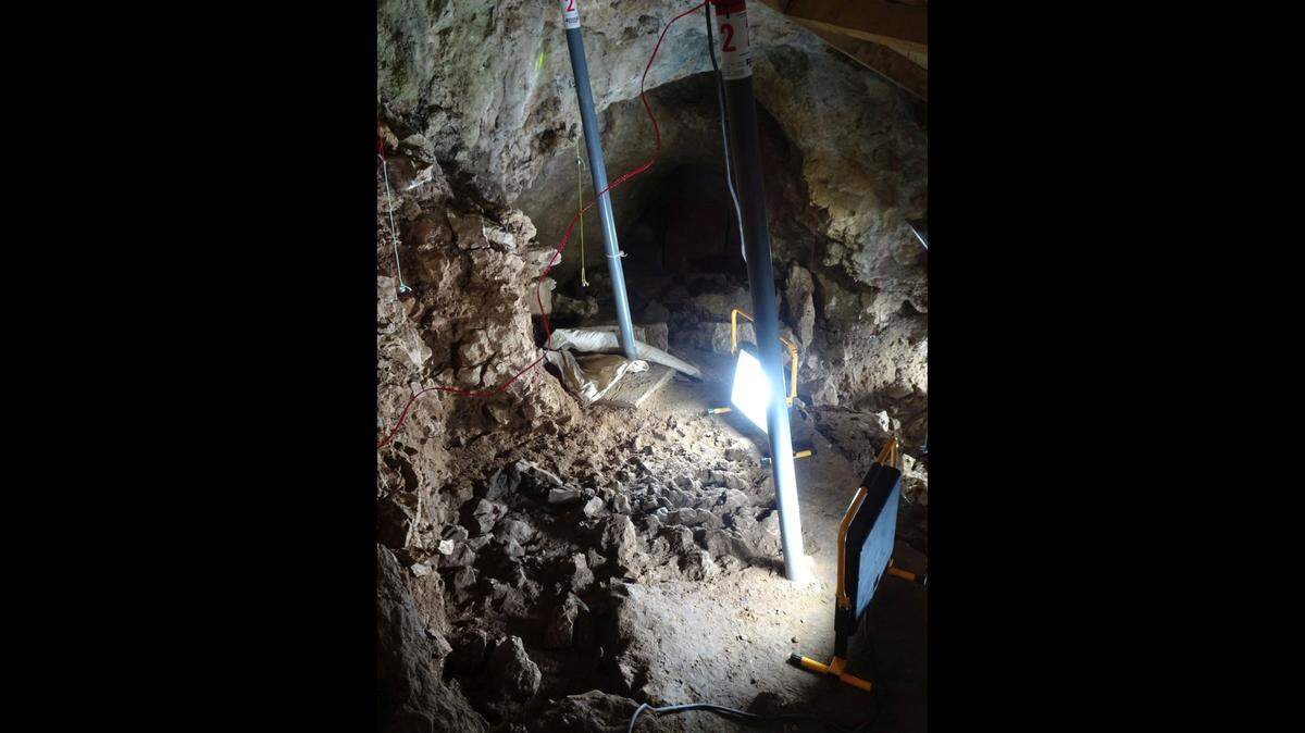 Archaeologists and students digging in Blätterhöhle cave uncovered a 9,000-year-old fireplace (above), flint arrowheads and a bone harpoon.