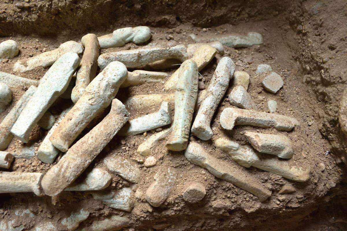 A pile of ushabti figures found in a 2,500-year-old tomb.