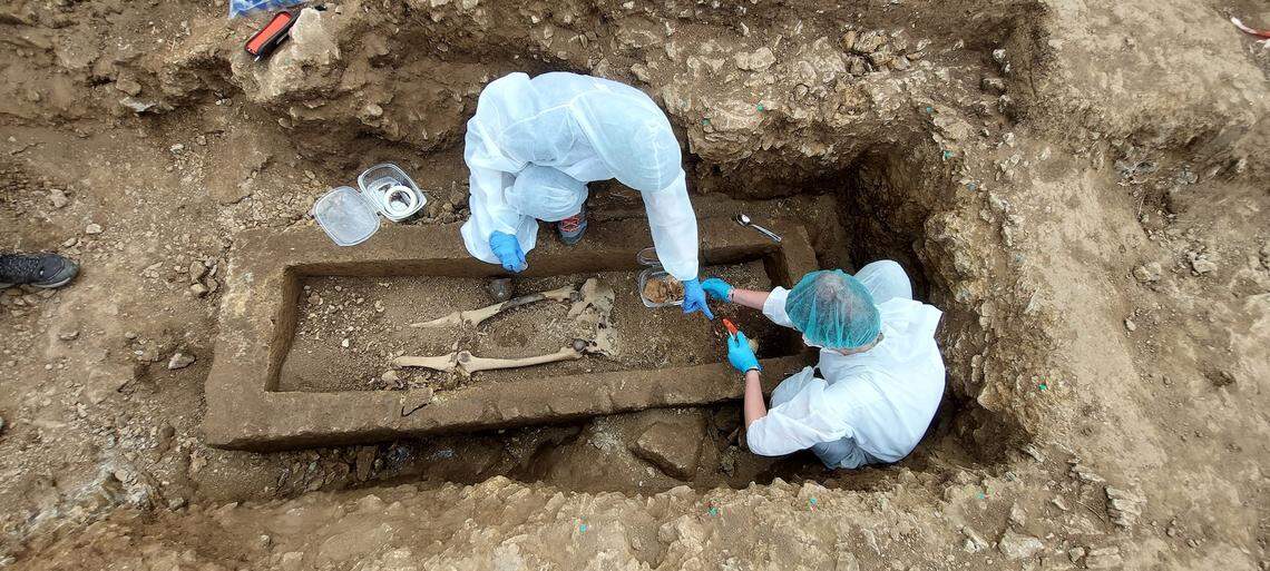 Archaeologist work on the inside of the 2,500-year-old sarcophagus in Bisenzio.