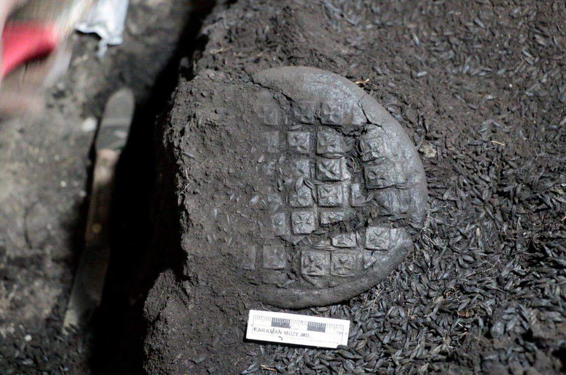 One of the 1,200-year-old bread loaves with a cross design found at Topraktepe.