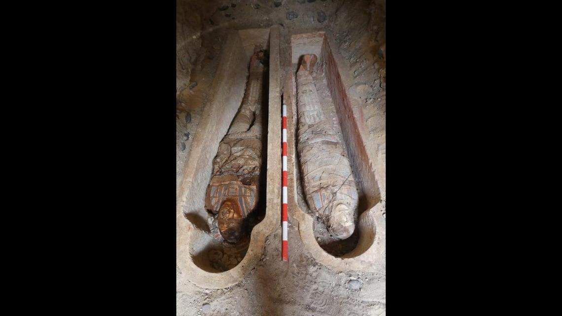Archaeologists excavated an ancient tomb in Al Bahnasa and uncovered mummies with golden tongues, amulets and wall paintings, photos show.