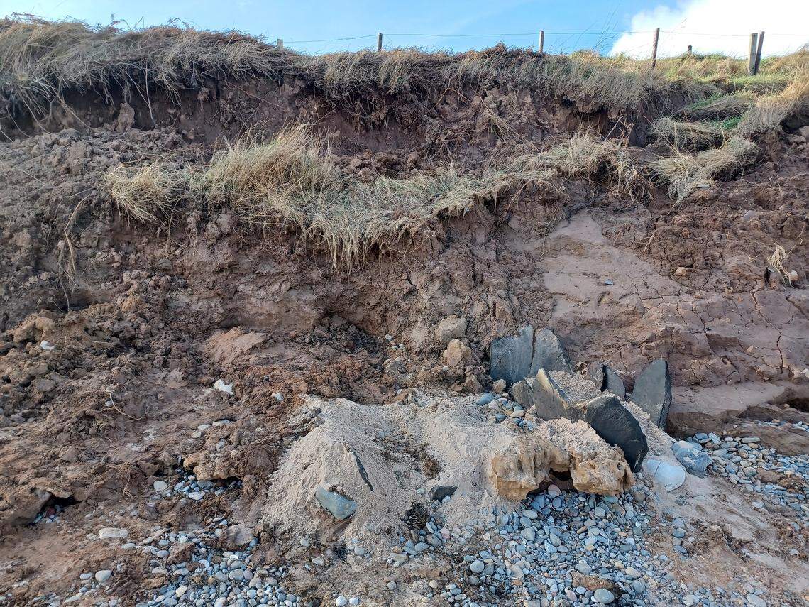 The partially exposed bait tanks reemerging from the cliff.