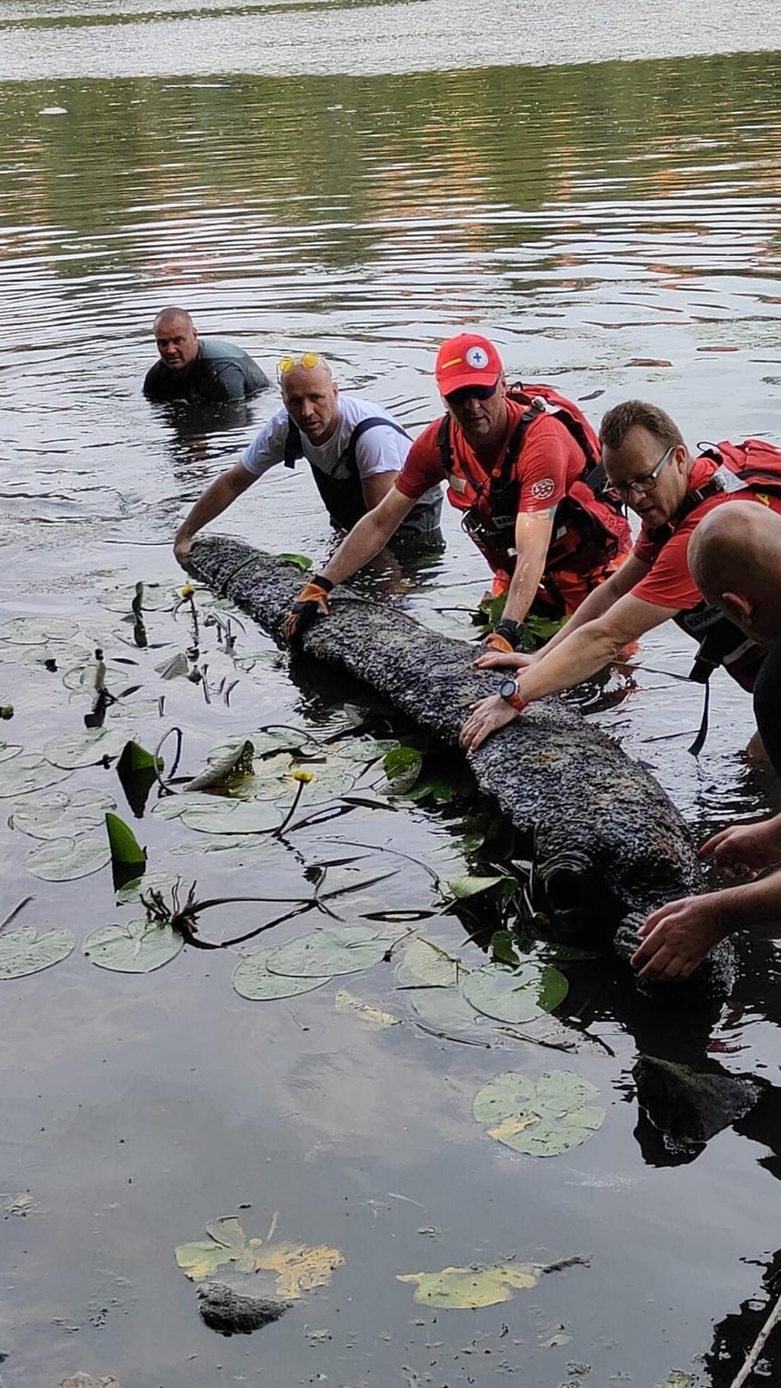 The group holds the 200-year-old canoe.