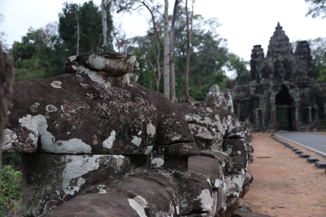 The headless 23rd Deva statue sitting along the entranceway to Angkor Thom’s Victory Gate