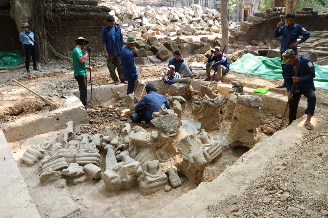 The partially excavated statues found at the 800-year-old Ta Prohm temple.