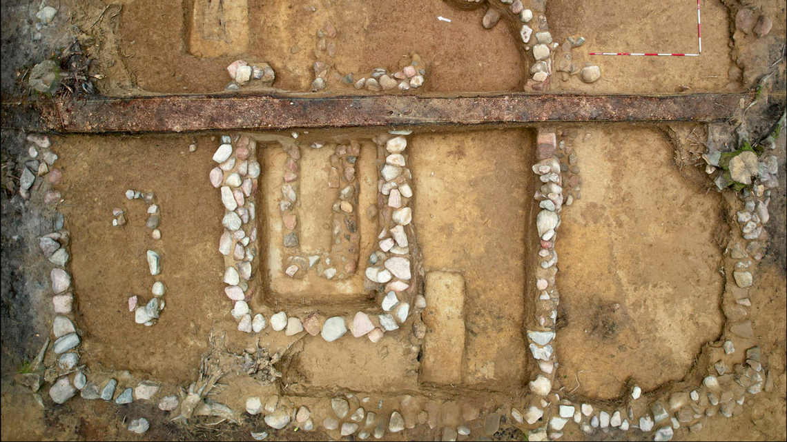 Archaeologists excavated a 900-year-old burial mound and found evidence of the graves being reopened by ‘looters,’ photos show.