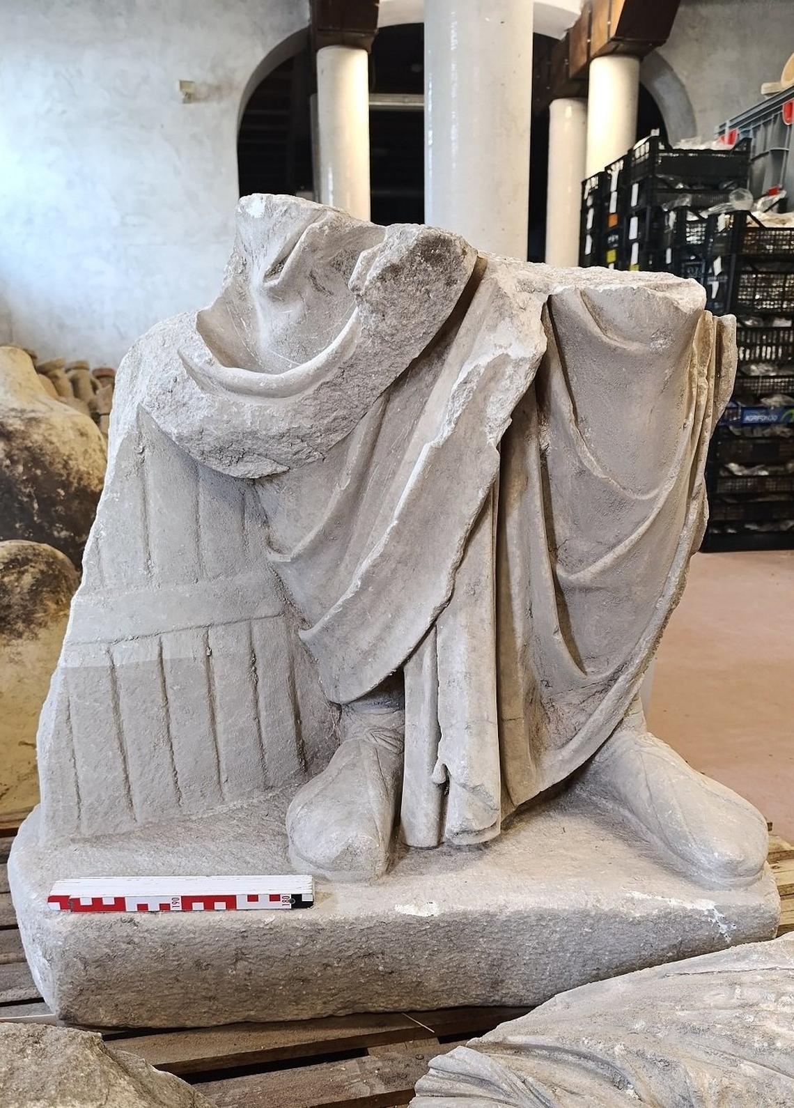A broken statue found at the ancient apse ruins.