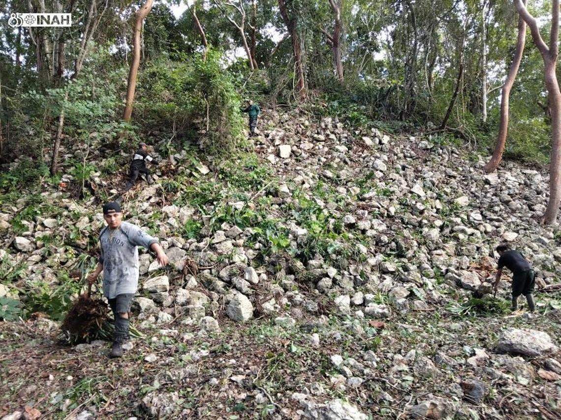 One of the ancient structures at X’baatún seen mid-cleaning project.