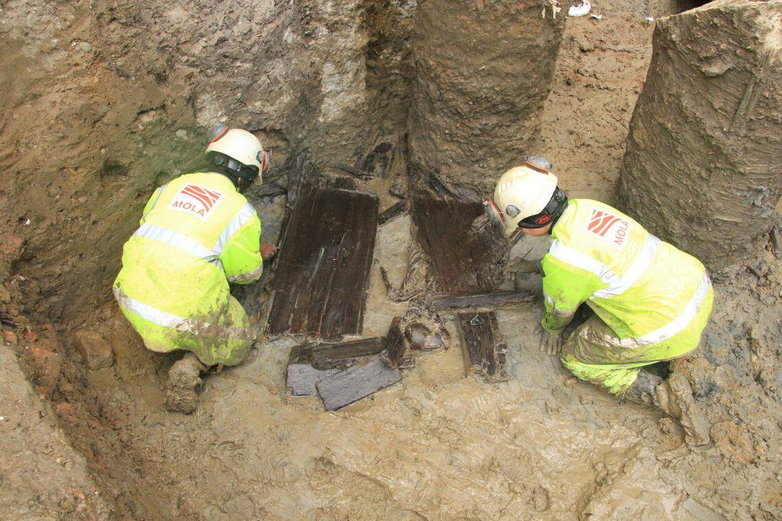 Archaeologists excavate the ancient Roman wooden coffins.