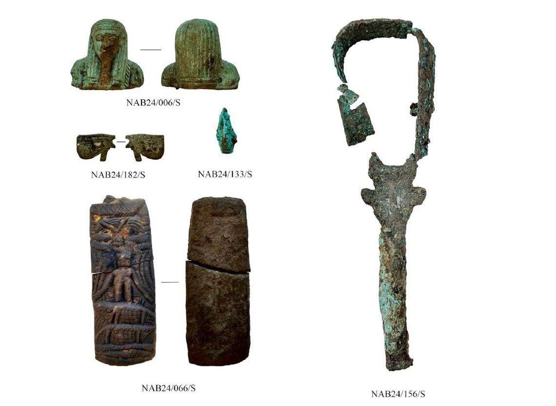 Some of the artifacts from the ancient city of Imet, including a green statue (top left), stone carving of Horus (bottom left) and musical instrument (right).