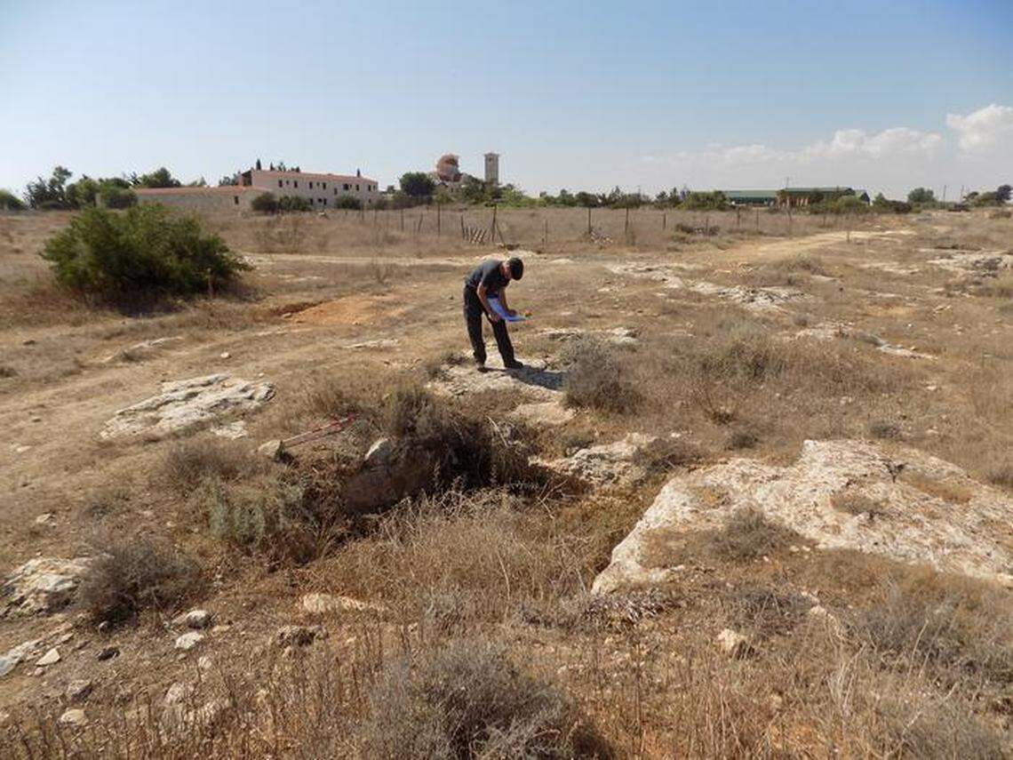 Archaeologist Matt Beamish examines an ancient tomb, likely from the Byzantine period.