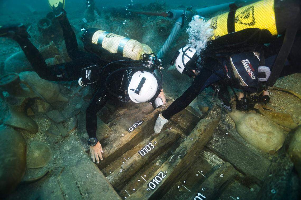 Divers excavate the ancient Roman shipwreck in the Formigues Islands.