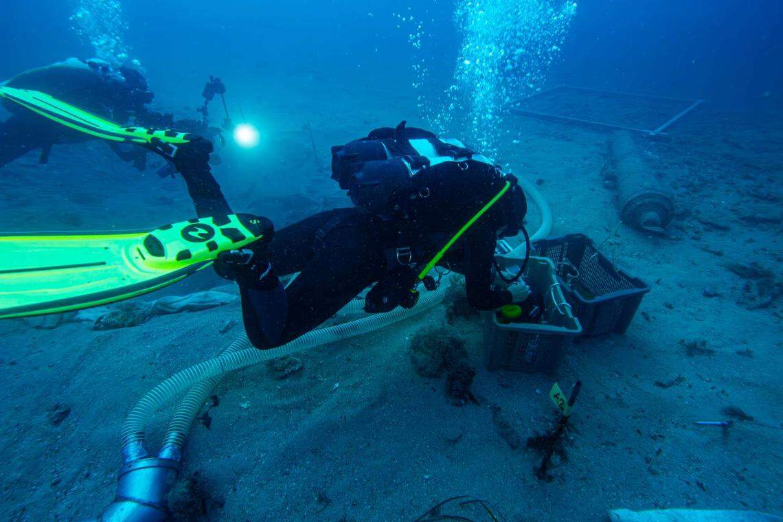 Archaeologists excavate the 400-year-old shipwreck.