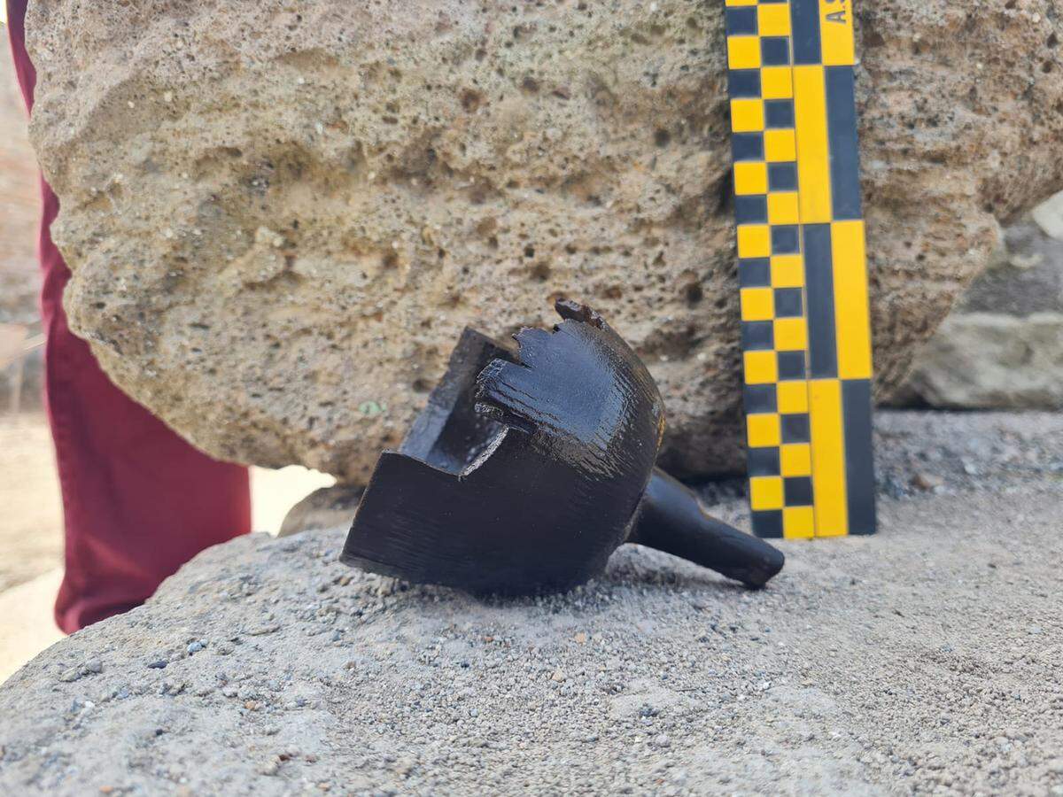 The ancient funnel-like artifact found in the well.