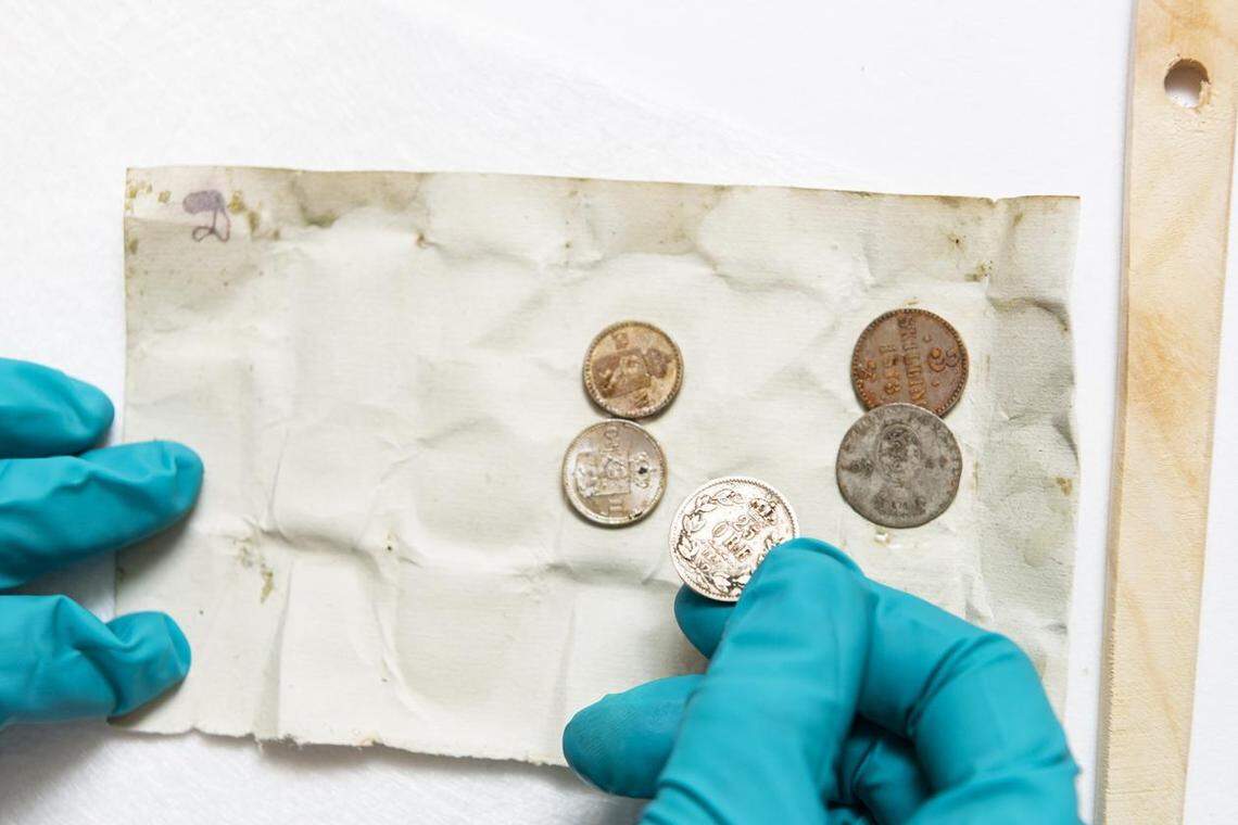 The coins found in the 140-year-old time capsule.