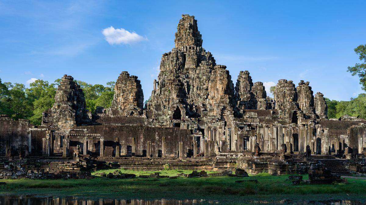 Archaeologists unearthed a “rare” sandstone turtle statue under a dried-up pond near 800-year-old Bayon temple in Cambodia, officials said and photos show.