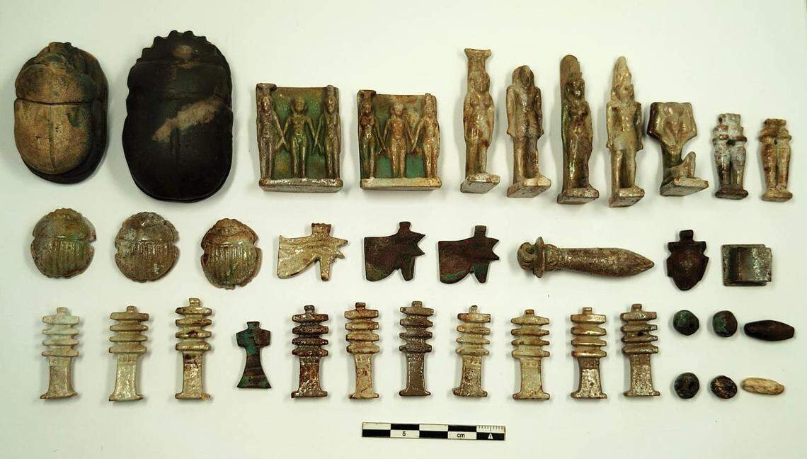 Some of the ancient amulets found at the tomb in Al Bahnasa.