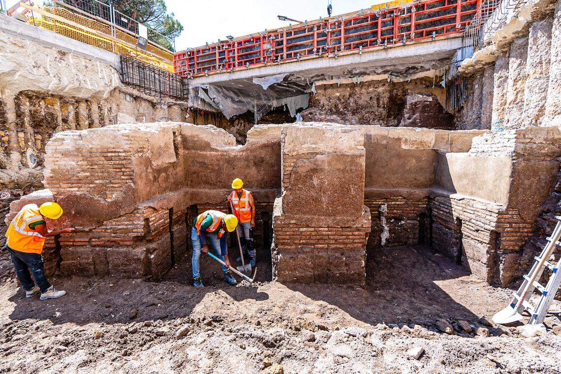 Archaeologists excavate the colonnaded portico.