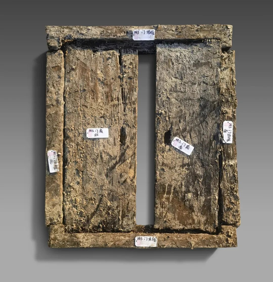 A miniature wooden window found in the M3 tomb.