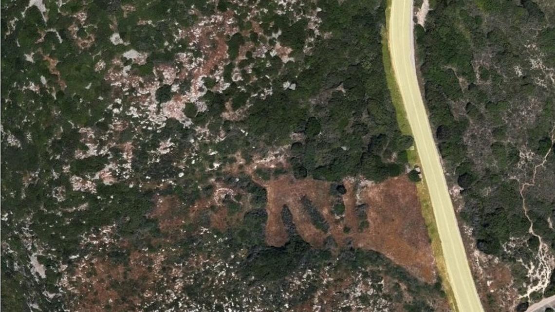 Archaeologists found an unusual pair of 3,100-year-old wells, likely used for mining and rituals, atop a hill in Cephalonia, photos show.