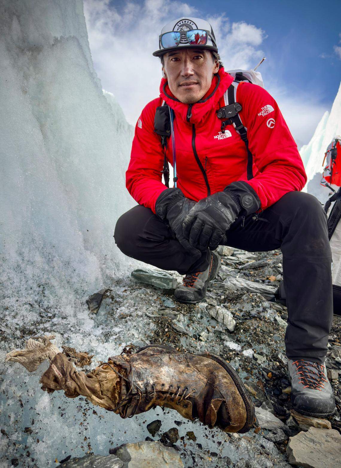 Jimmy Chin next to the boot believed to be the 100-year-old remains of Andrew “Sandy” Irvine.