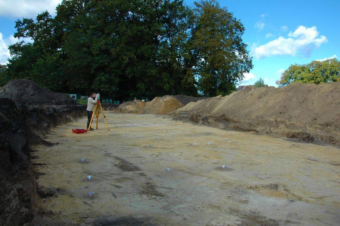 Some of the post holes, marked with flags, at the ancient site in Harsewinkel.