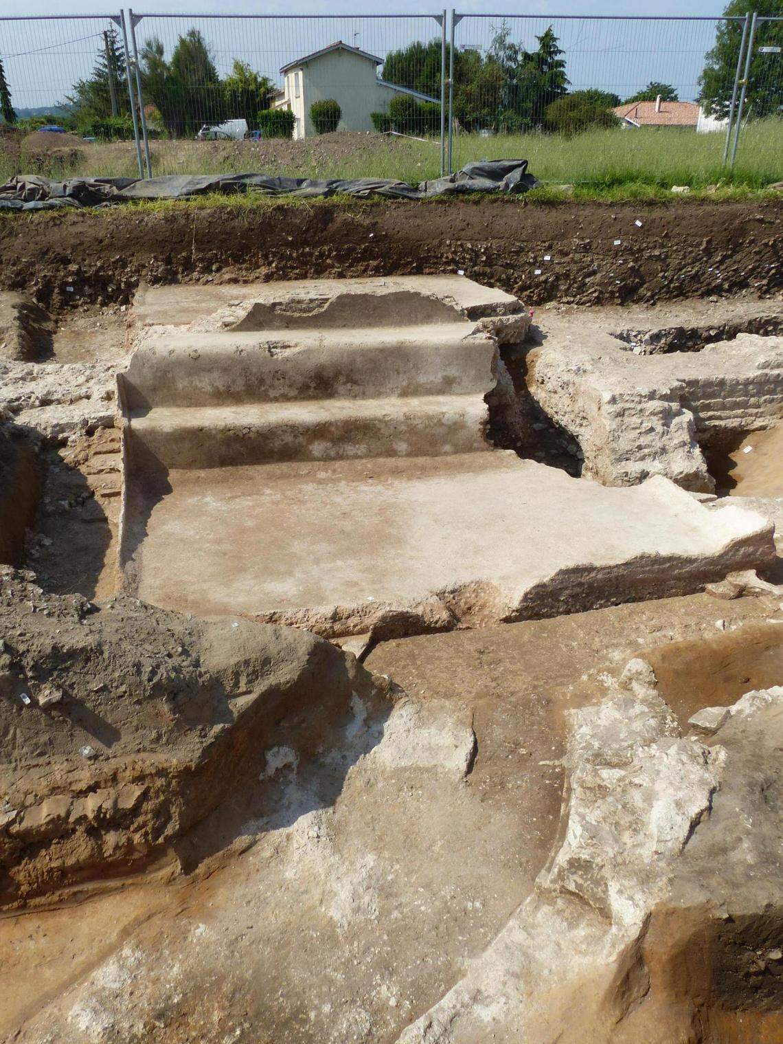 Stone steps leading into a pool at the bathhouse.