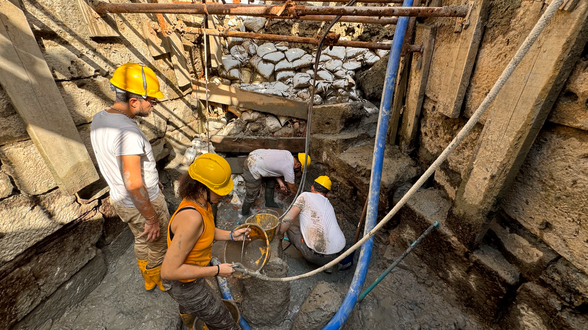 Archaeologists excavating a 2,000-year-old sanctuary in Italy found eggs and bronze figures left in a hot spring as gifts, photos show.