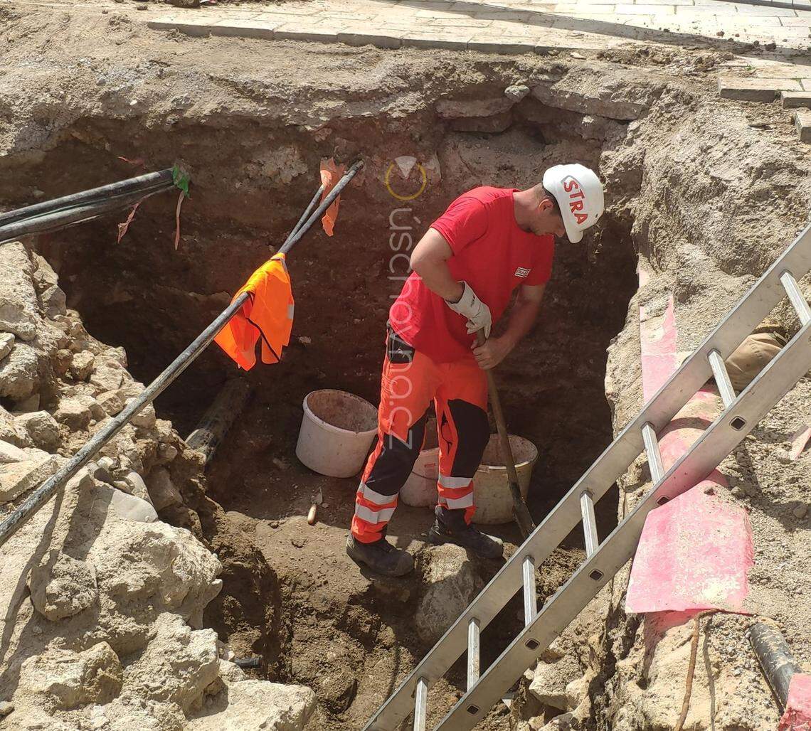 An archaeologist excavates the medieval underground passageway.